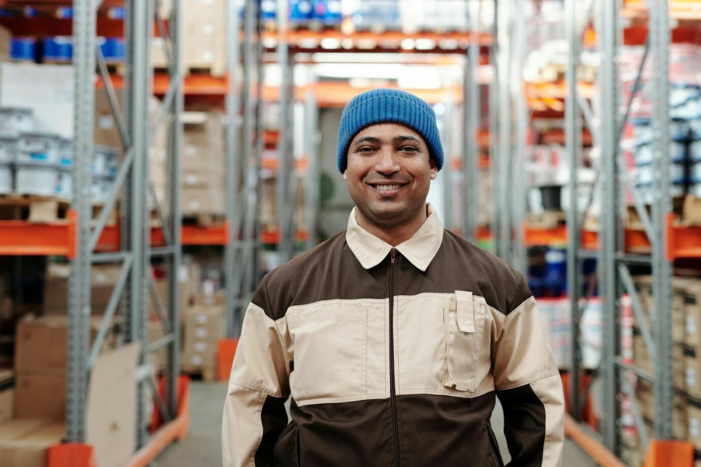 Photo of Man Wearing Blue Beanie Smiling